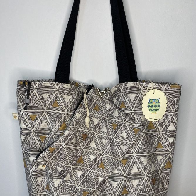 Designer maxi bag with matching toiletry bag, geometric print