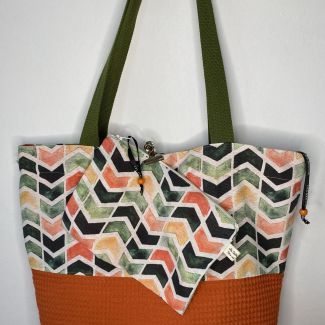 Designer maxi bag with matching toiletry bag, orange color combined with geometric print