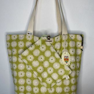 Designer maxi bag with matching toiletry bag in a pistachio-colored print.