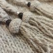 Hand-knitted triangular scarf